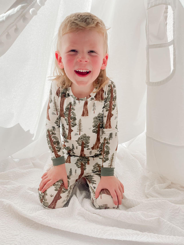 boy wearing redwoods print pajamas for kids