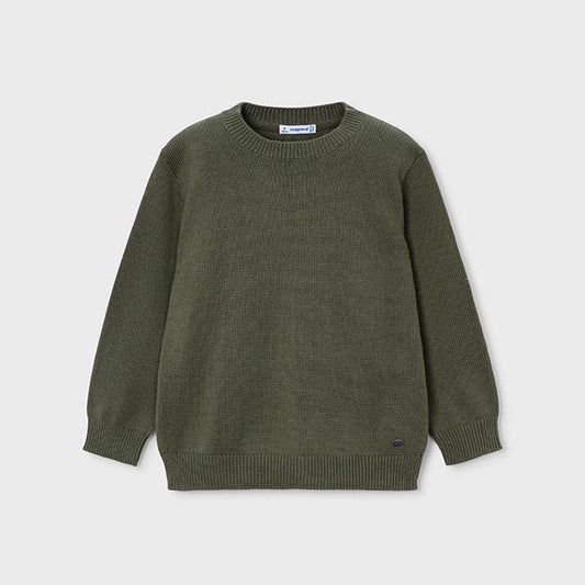 Green sweater on a light gray background