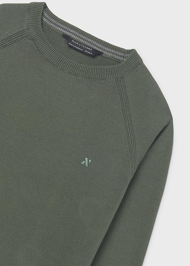 Green sweater with a small logo on a white background