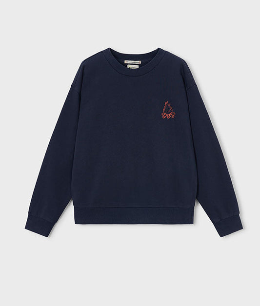 navy crewneck sweatshirt with a small logo on the right side, in neon orange featuring a small campfire.