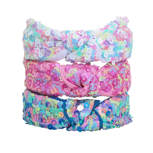 Three colorful sequin headbands stacked on a white background