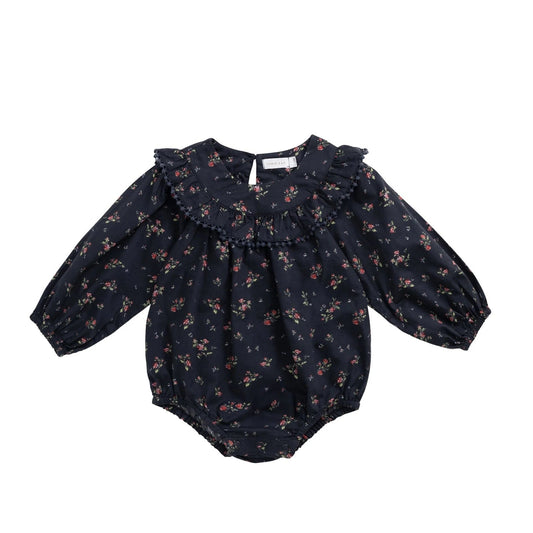 Black floral baby romper on a white background