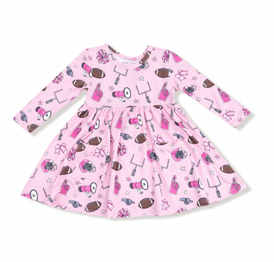 Pink dress with football-themed pattern on a white background