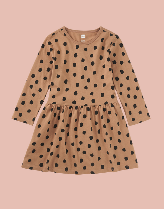 Brown dress with black polka dots on a white background