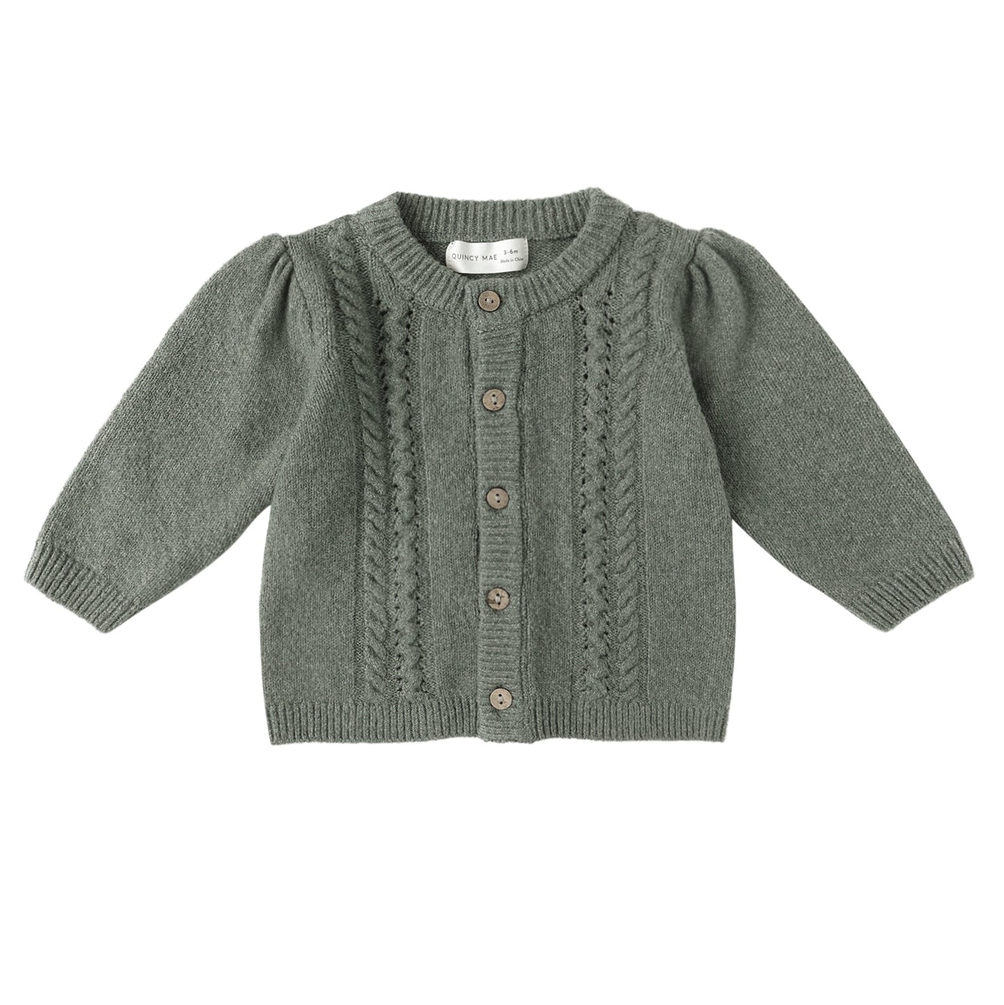 Green knitted cardigan on a white background