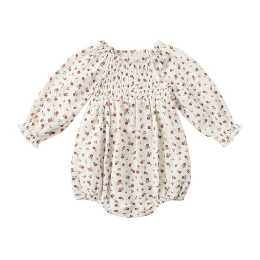 Baby romper with floral pattern on a white background