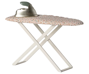 Ironing board with floral ironing board cover on a white background