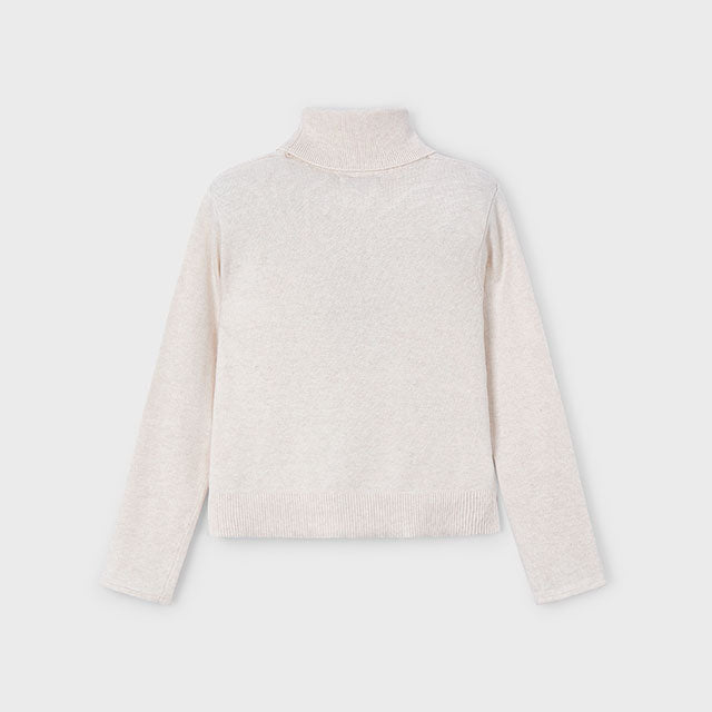 Light beige turtleneck sweater on a white background