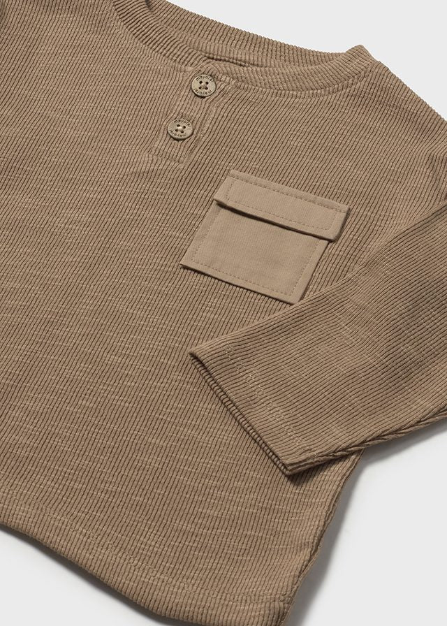 Brown long-sleeve shirt with buttons and a pocket on a light gray background