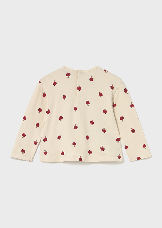 Beige sweater with red apple pattern on a white background