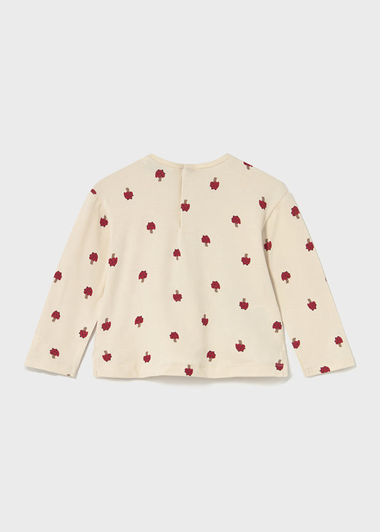 Beige sweater with red apple pattern on a white background