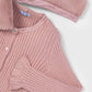 Pink ribbed cardigan with removable faux fur collar on a light gray background