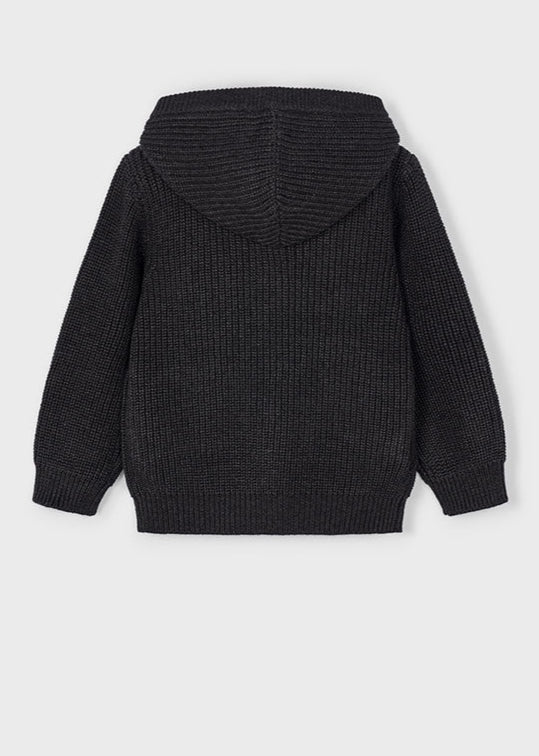 Black knitted hoodie on a light gray background