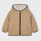 Beige quilted jacket with a hood on a light gray background