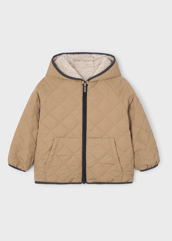 Beige quilted jacket with a hood on a light gray background