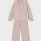A two-piece children's knit loungewear set in a soft, heathered dusty pink color, featuring a hooded sweatshirt with drawstrings and matching wide-leg pants, displayed on a light gray background.