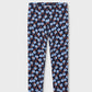 A pair of children's leggings with an all-over repeating pattern of light blue flowers on a dark navy background, shown flat against a light gray studio backdrop.