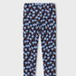 A pair of children's leggings with an all-over repeating pattern of light blue flowers with orange centers on a dark navy background, shown flat against a light gray background.
