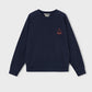 navy crewneck sweatshirt with a small logo on the right side, in neon orange featuring a small campfire.