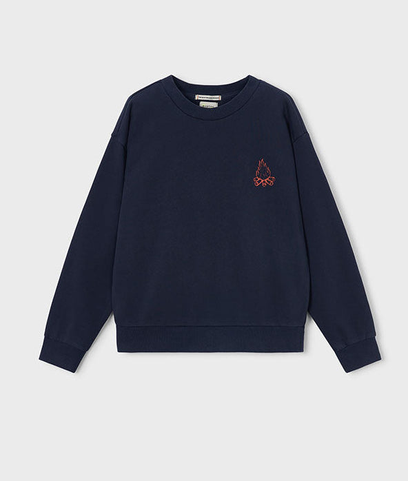 navy crewneck sweatshirt with a small logo on the right side, in neon orange featuring a small campfire.