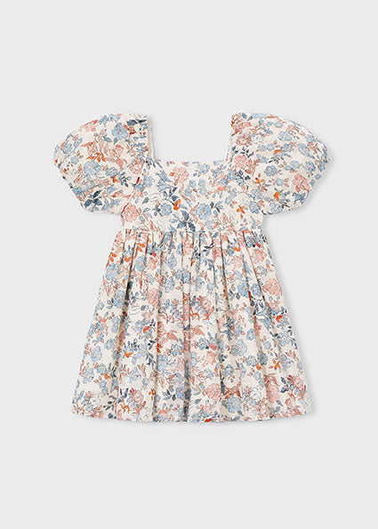 Floral dress with puff sleeves on a light gray background