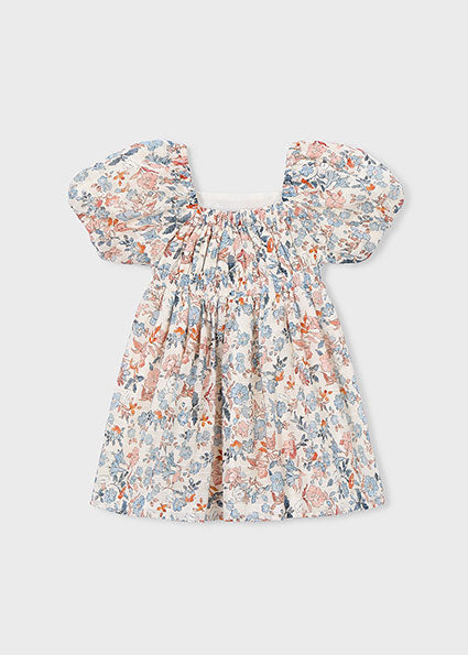 Floral dress with puff sleeves on a light gray background