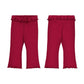 A pair of toddler flare leggings shown from both the front and back views. The leggings are made of a ribbed fabric with a ruffled waistband, front button closure, and a back patch pocket, in a deep magenta color.