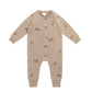 Beige baby sweater onesie with acorns detail and button details on a white background