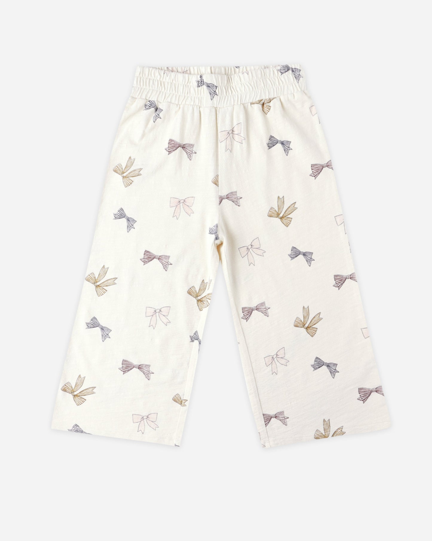 Natural tone wide leg pants with bow pattern on a white background