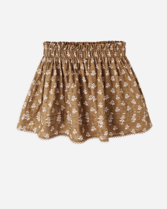 Golden brown floral-patterned skirt on a white background