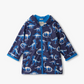 Navy raincoat with dinosaur pattern on a white background