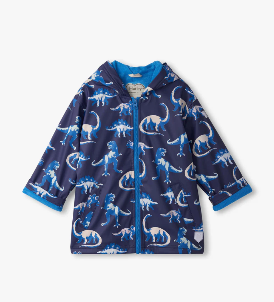 Navy raincoat with dinosaur pattern on a white background
