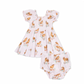 Baby dress and romper set with dog print on a white background