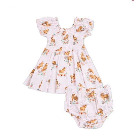 Baby dress and romper set with dog print on a white background