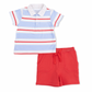 Children's outfit with striped polo shirt and red shorts on a white background