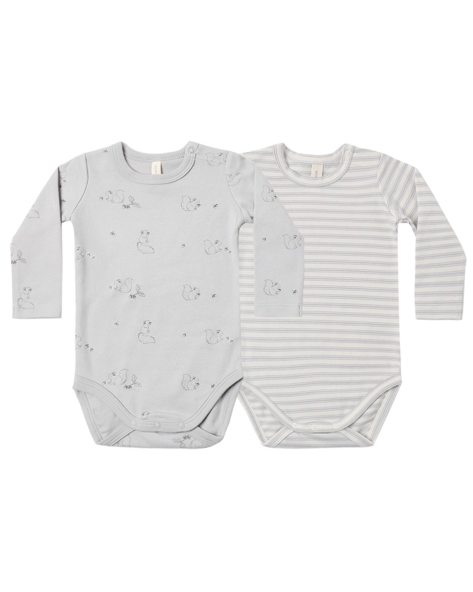 Two baby bodysuits with different patterns on a white background