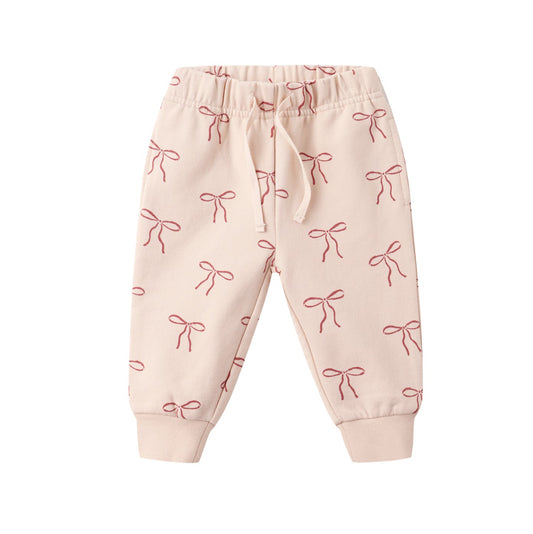 Pink baby pants with bow pattern on a white background