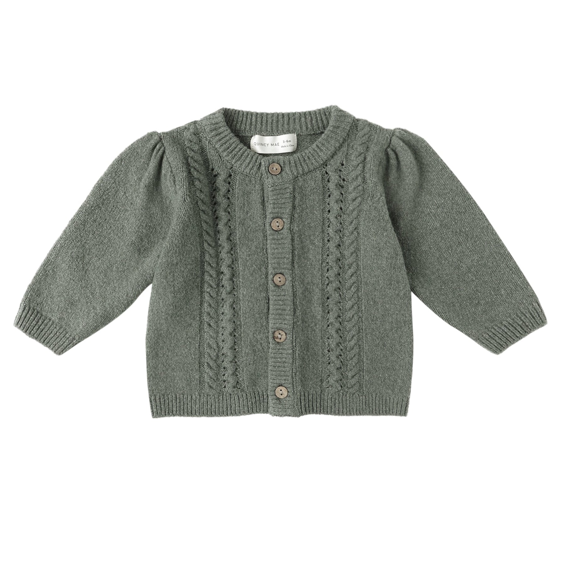 Green knitted cardigan on a white background