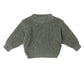 Green knitted sweater on a white background
