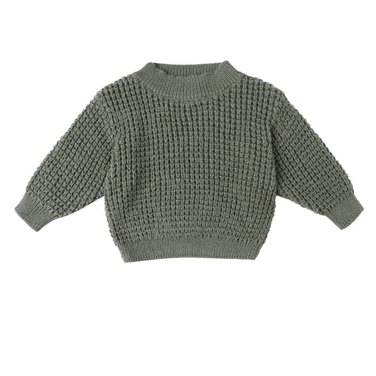 Green knitted sweater on a white background