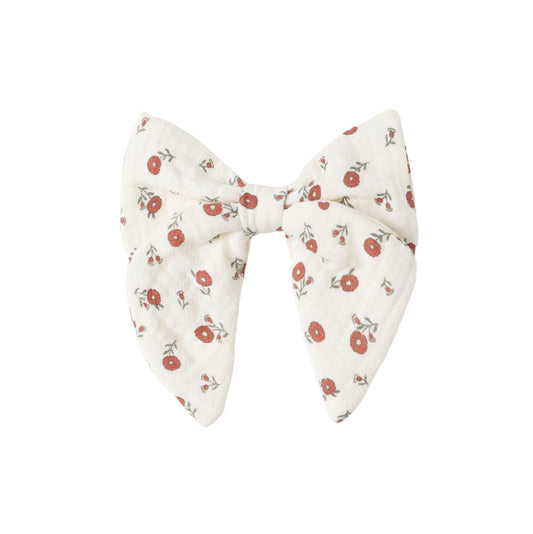 Floral-patterned bow on a white background